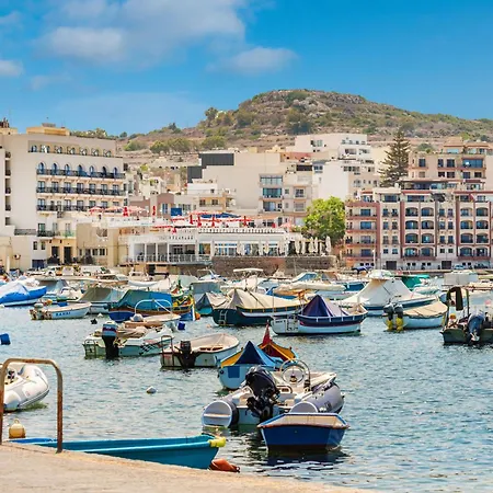 Islet Promenade Seafront With Large Corner Terrace By Getawaysmalta *