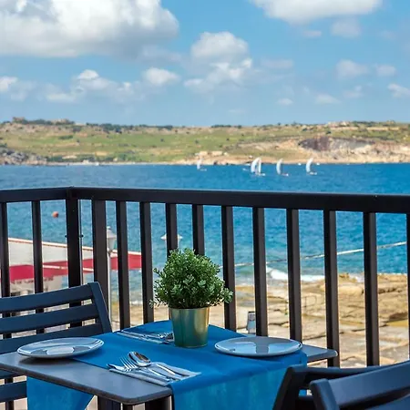 Islet Promenade Seafront With Large Corner Terrace By Getawaysmalta