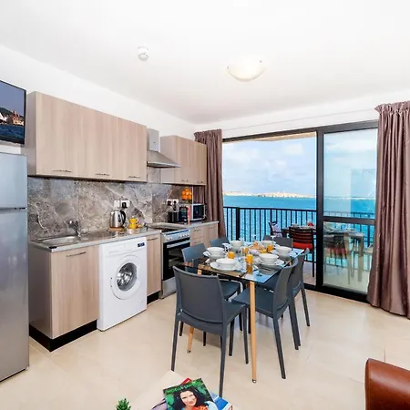 Islet Promenade Seafront With Large Corner Terrace By Getawaysmalta