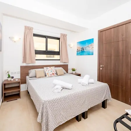 Islet Promenade Seafront With Large Corner Terrace By Getawaysmalta