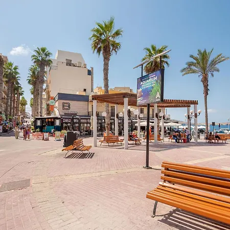 Islet Promenade Seafront With Large Corner Terrace By Getawaysmalta