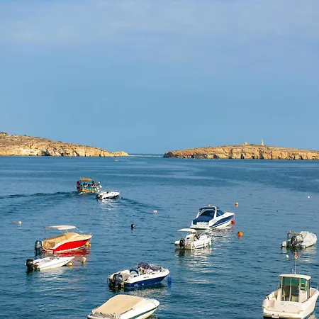Islet Promenade Seafront With Large Corner Terrace By Getawaysmalta