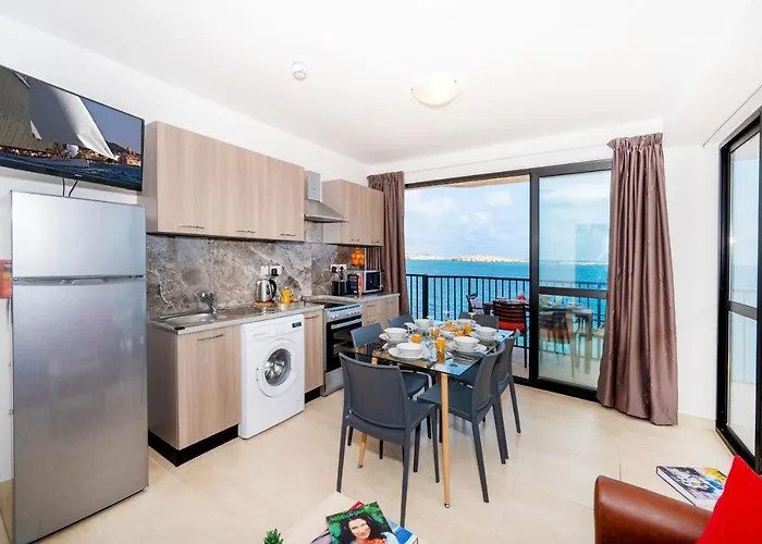 Islet Promenade Seafront With Large Corner Terrace By Getawaysmalta