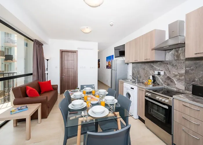 Islet Promenade Seafront With Large Corner Terrace By Getawaysmalta