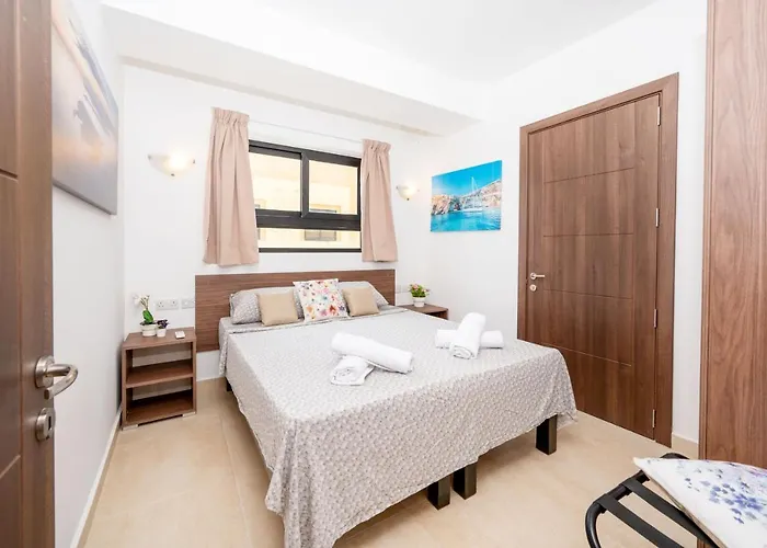 Islet Promenade Seafront With Large Corner Terrace By Getawaysmalta