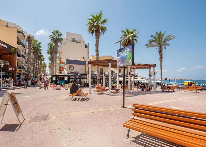 Islet Promenade Seafront With Large Corner Terrace By Getawaysmalta