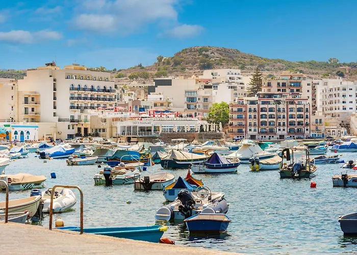 Islet Promenade Seafront With Large Corner Terrace By Getawaysmalta *